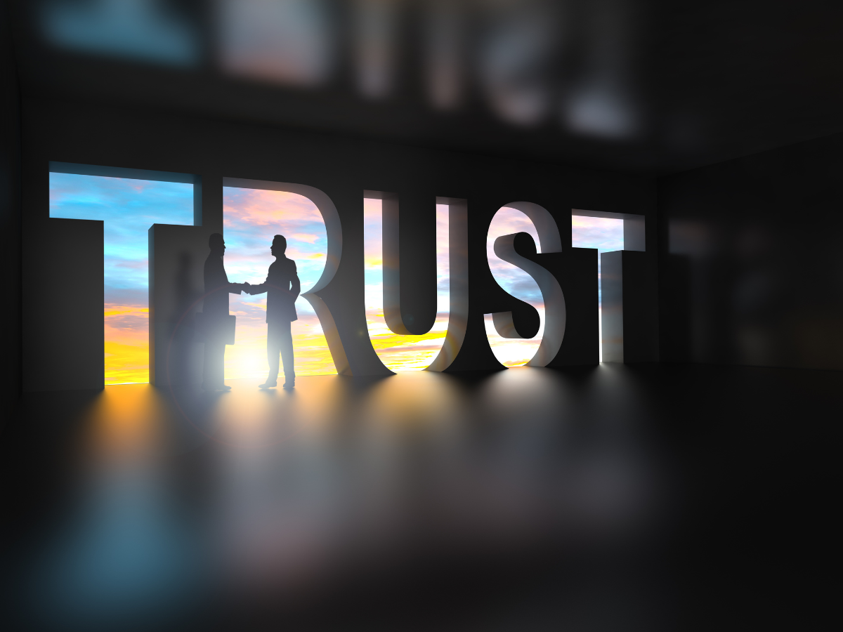 The word trust with person standing in it